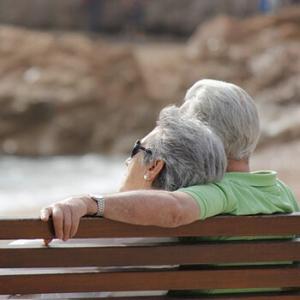 gray haired couple on bench