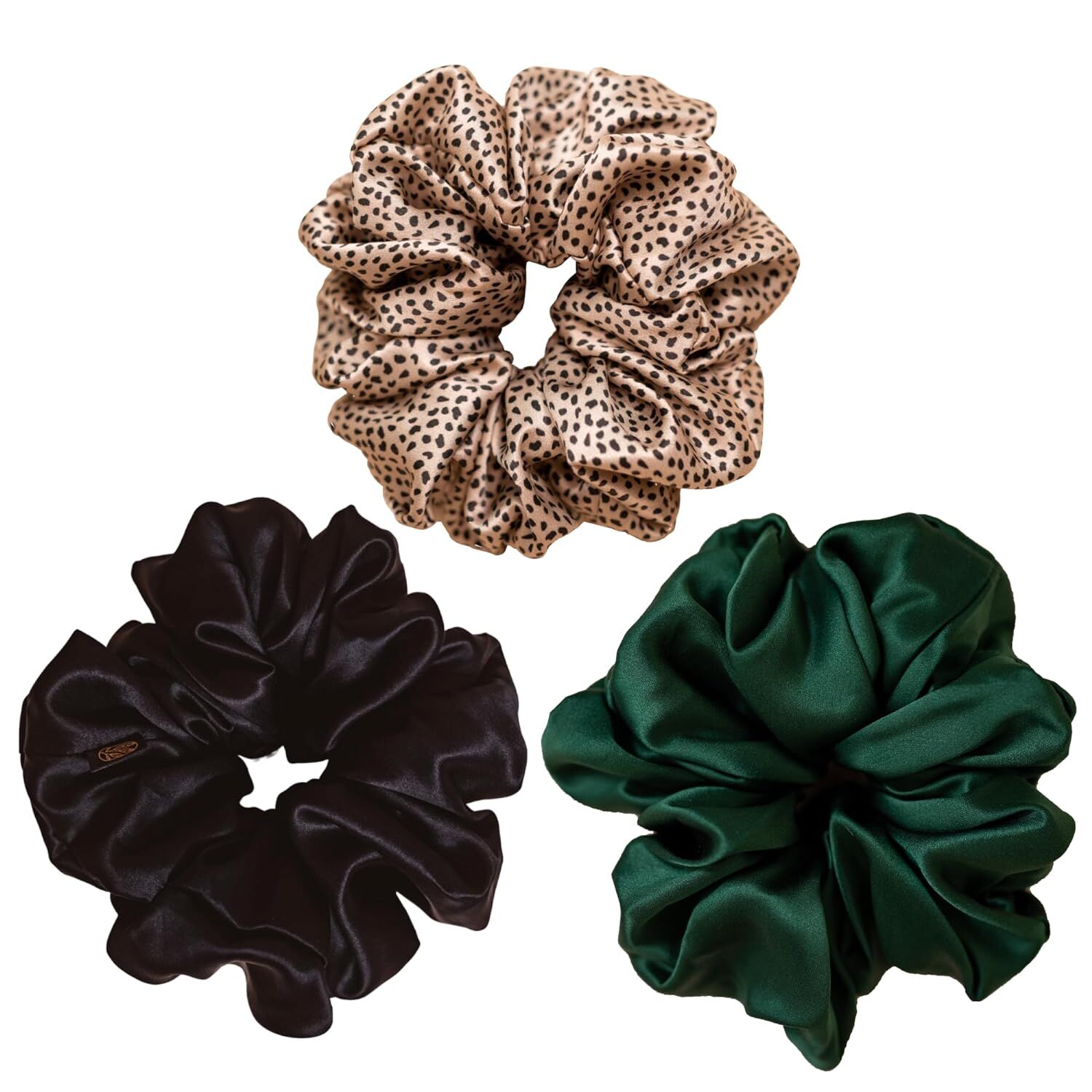 three curlfriend collective scrunchies in black, dark green, and print